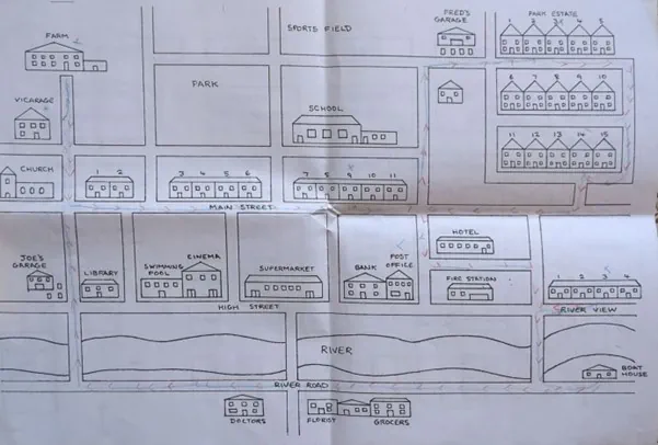A hand drawn map of a town, showing buildings, streets and places.